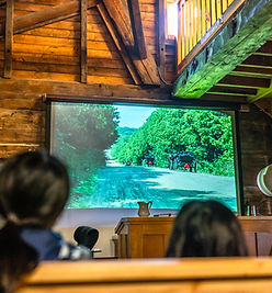 Guests enjoying a informational video in Mennonite Story at St Jacobs Farmers Market 