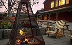 A enclosed outdoor firepit in front of the 2 story Market Building 