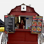 A vendor standing in Conestoga Fries wagon