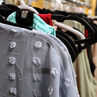 A rack of women's clothing from The Happy Closet 