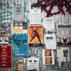 A selection of posters attached to a wall with graffiti art from Posters and more 