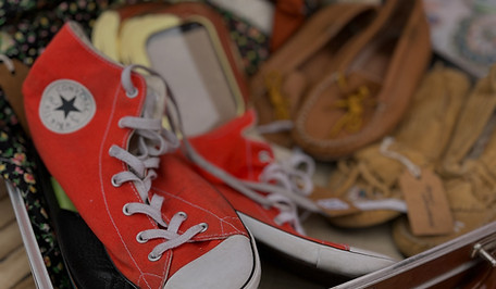 Several pairs of vintage shoes inside a vintage suitcase at St. Jacobs Market Road Antiques