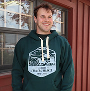 A man wearing the St. Jacobs Farmers Market 50th anniversary Logo Hoodie