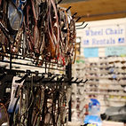 a displayed filled with reading glasses and Sunglasses from Looney Lynn's 