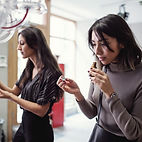 two women smelling fragrances from Aromatic Fumes 