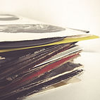 A stack of records from CJ's Vinyl 