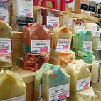 A display of beautiful artisan soaps by Scents by Shaizy