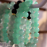 several beadded bracelets hanging on a display made by Sivid 