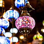 Assortment of beautiful glass lights hanging at Lover of the Light 