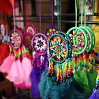 A selection of indigenous art pieces hanging on display from Sumak Art 