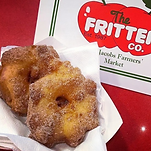 Delicious apple fritters coated in cinnamon sugar, made By The Fritter Co. 